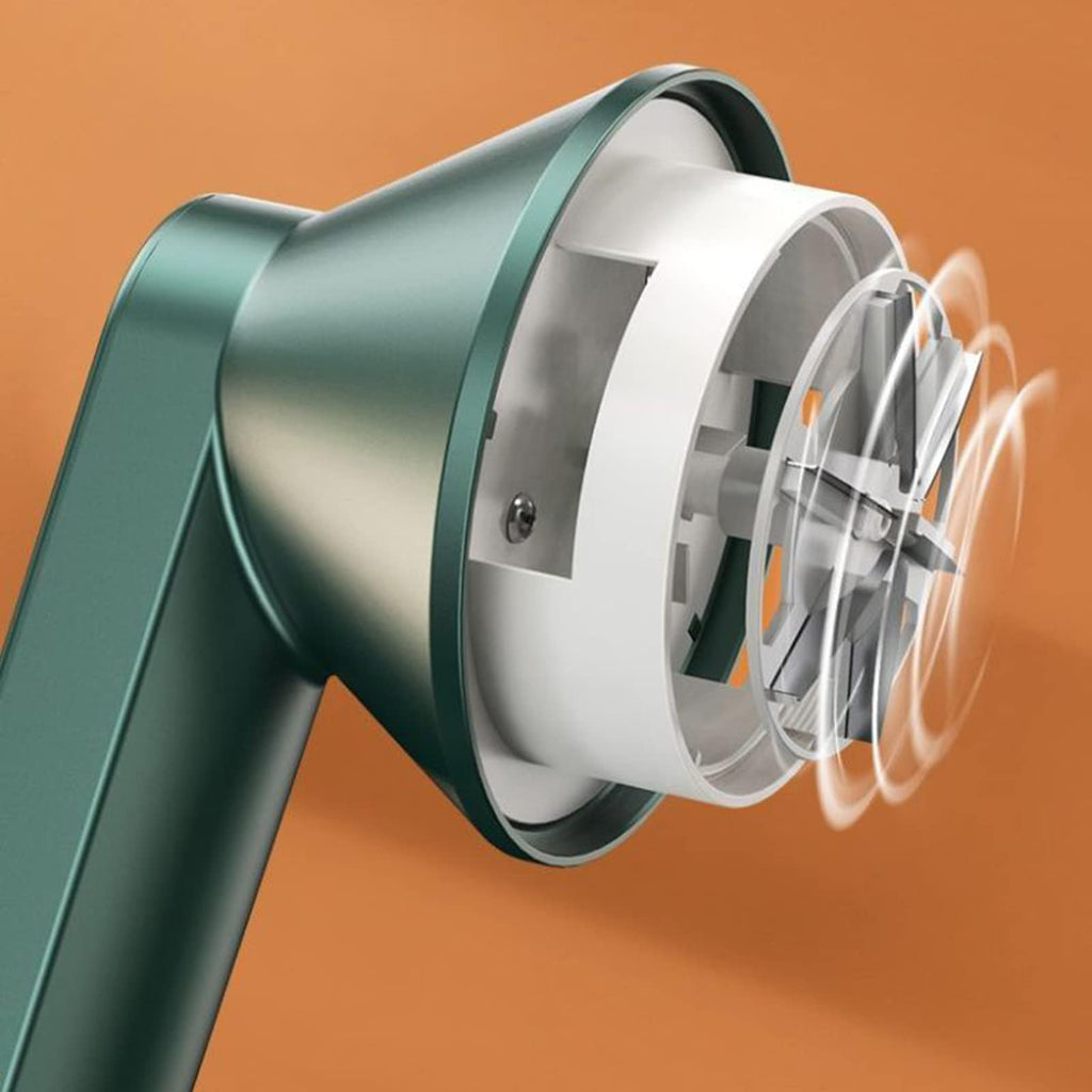 Green rechargeable fabric shaver close-up showing perforated shaving head and blade drum