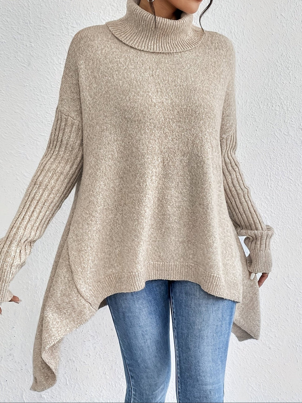 Women's loose turtleneck sweater in cream, long sleeves, ribbed cuffs, asym hem