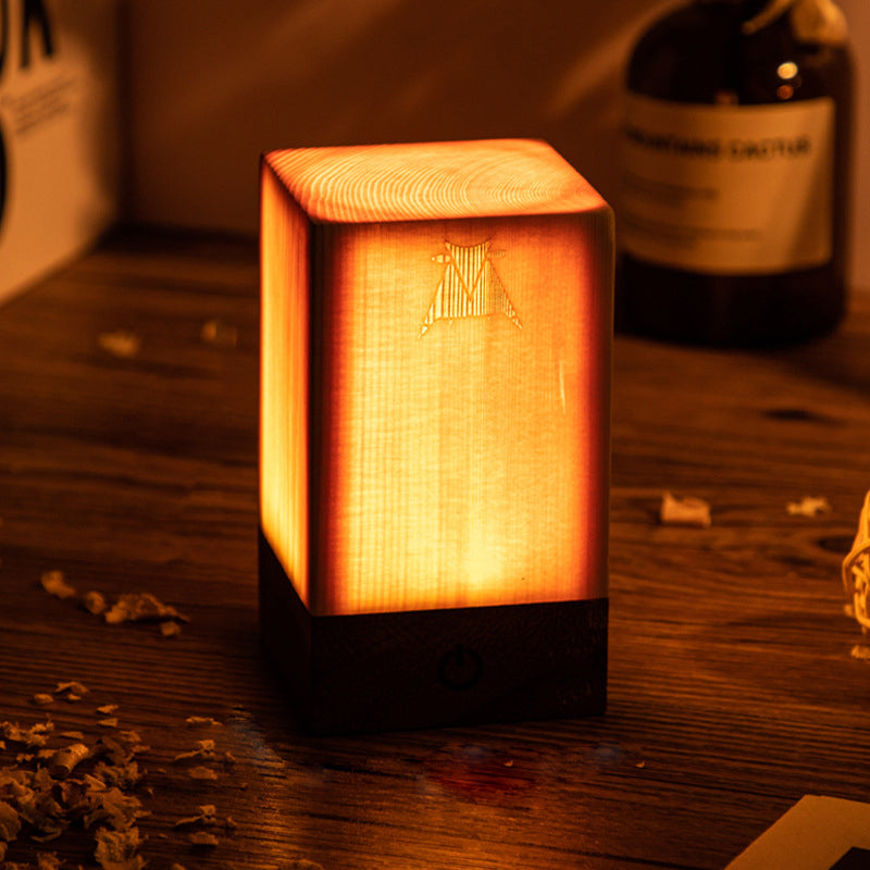 Cube-style wood-look LED night light with warm glow, engraved star panel, dark base