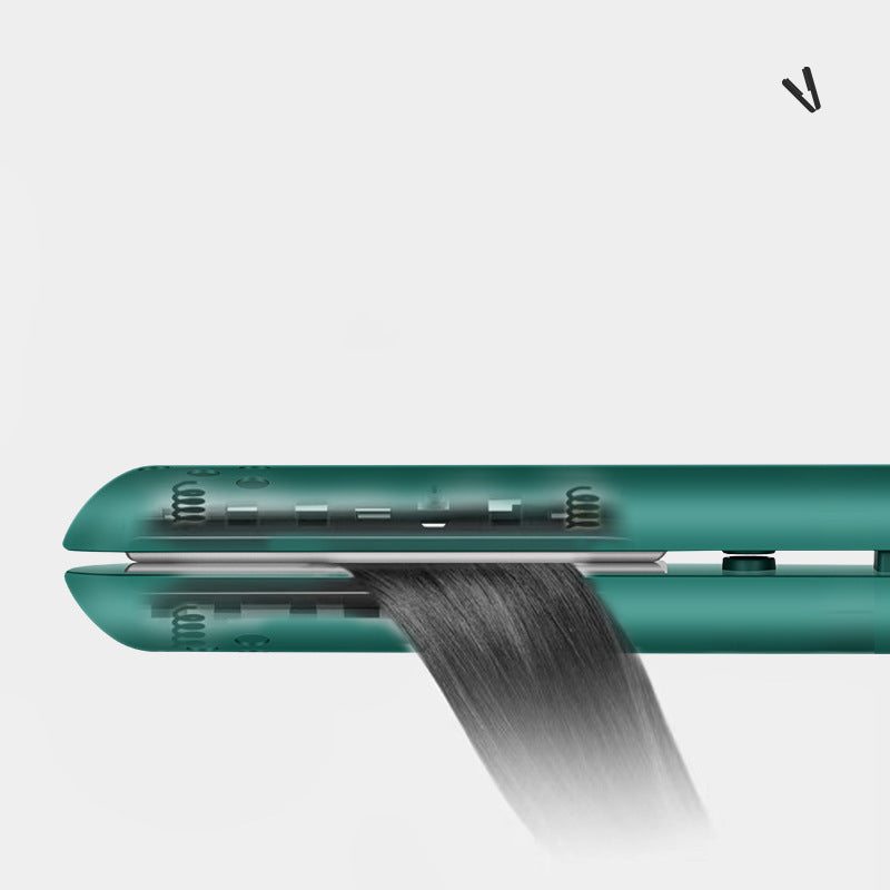 Mini 2-in-1 travel curling and straightening iron, teal/green barrel close-up