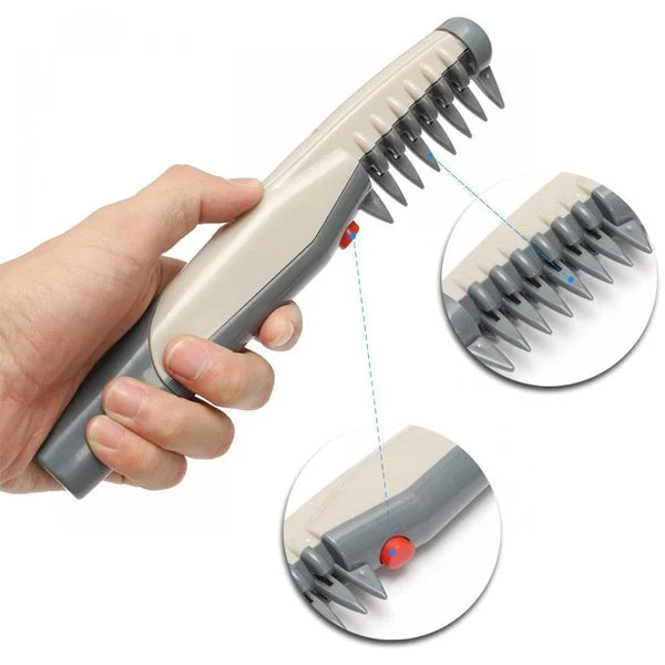Hand holding cordless trimmer; close-up of comb teeth and red power button