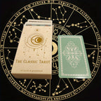 Classic tarot card set box with tarot cards, including The Moon and The Strength, plus green card back