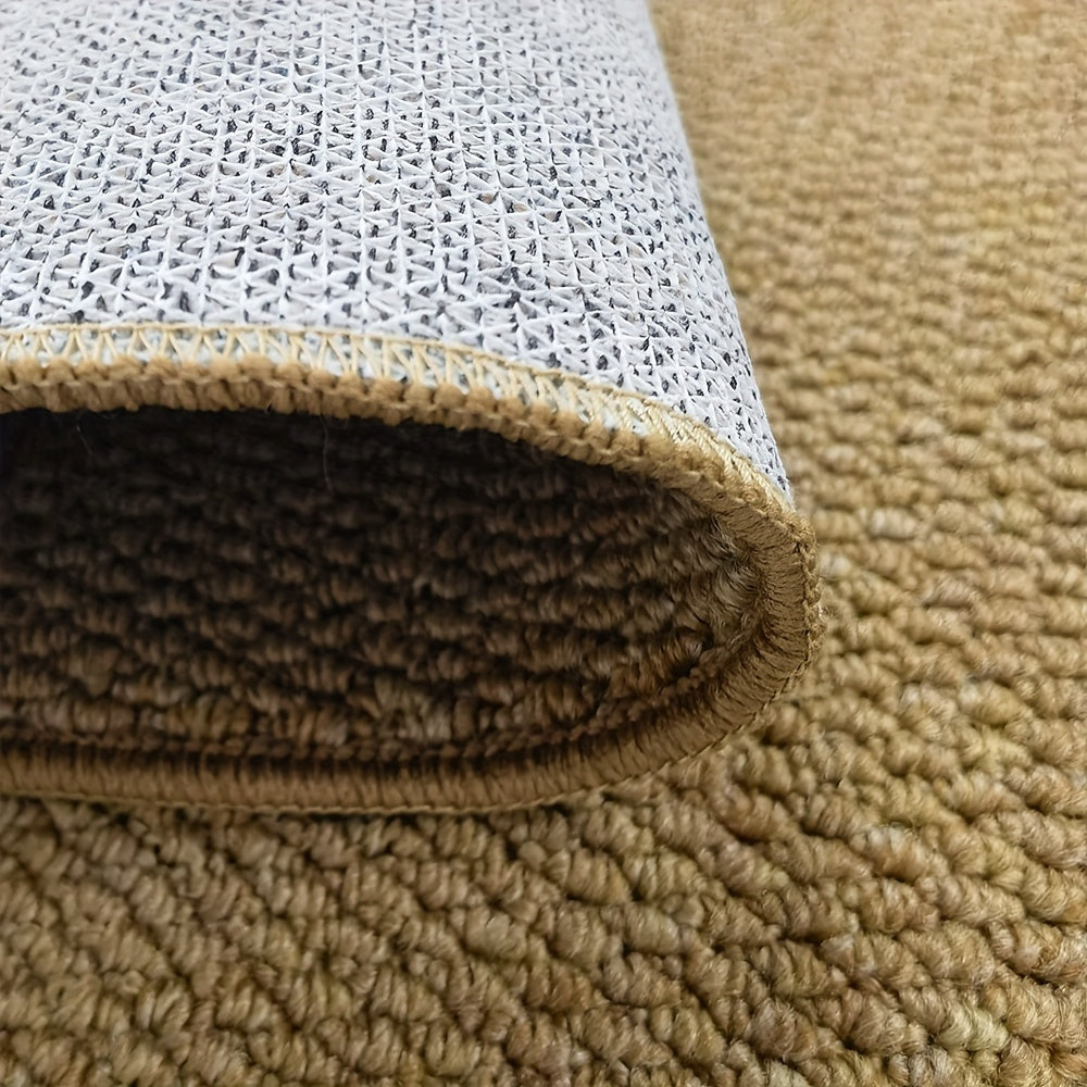 Close-up of jute-look doormat edge with beige pile and white non-slip backing.