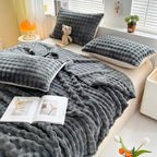 Bubble-texture fleece blanket in dark gray with stitched ridged pattern, couch throw