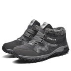 Gray winter boots with faux fur collar, hook-and-loop straps, deep lug traction sole