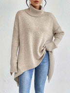 Women's loose turtleneck sweater in light beige, long sleeves, ribbed cuffs, asym hem