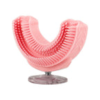 Pink U-shaped soft silicone brush head on clear standing base