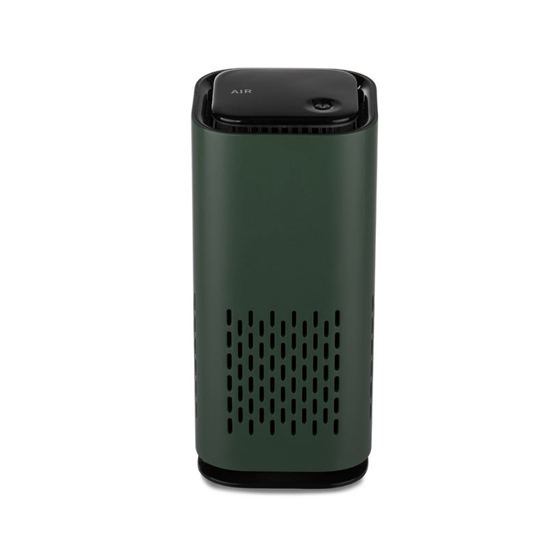 Green cylindrical air purifier with top controls and front vent grille
