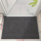 Gray low-profile entry doormat with dense ribbed stripe surface and border