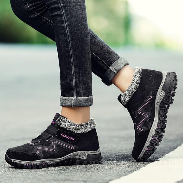 Black winter boots with faux fur collar and hook-and-loop straps, non-slip tread sole