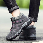Gray winter boots with faux fur collar, padded details, hook-and-loop straps and tread