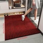 Red striped doormat placed in doorway with thick low-pile texture and flat edges