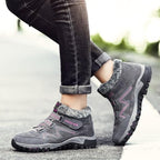 Gray winter boots with faux fur trim, strap closure, rugged non-slip sole