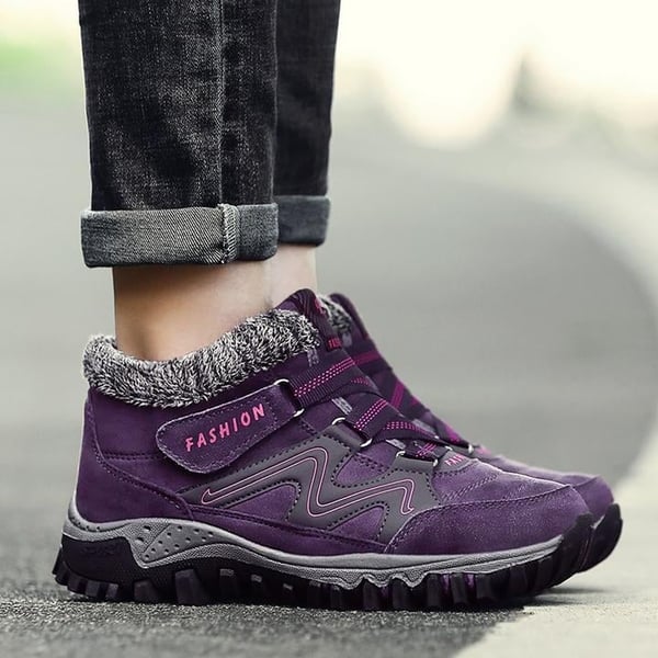 Purple winter boots with faux fur lining and strap closure, textured lug tread sole