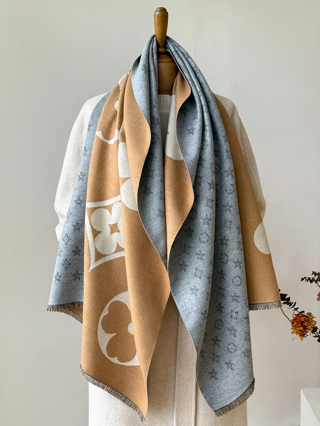 Oversized jacquard scarf in blue-gray and camel with large floral and monogram-style motifs
