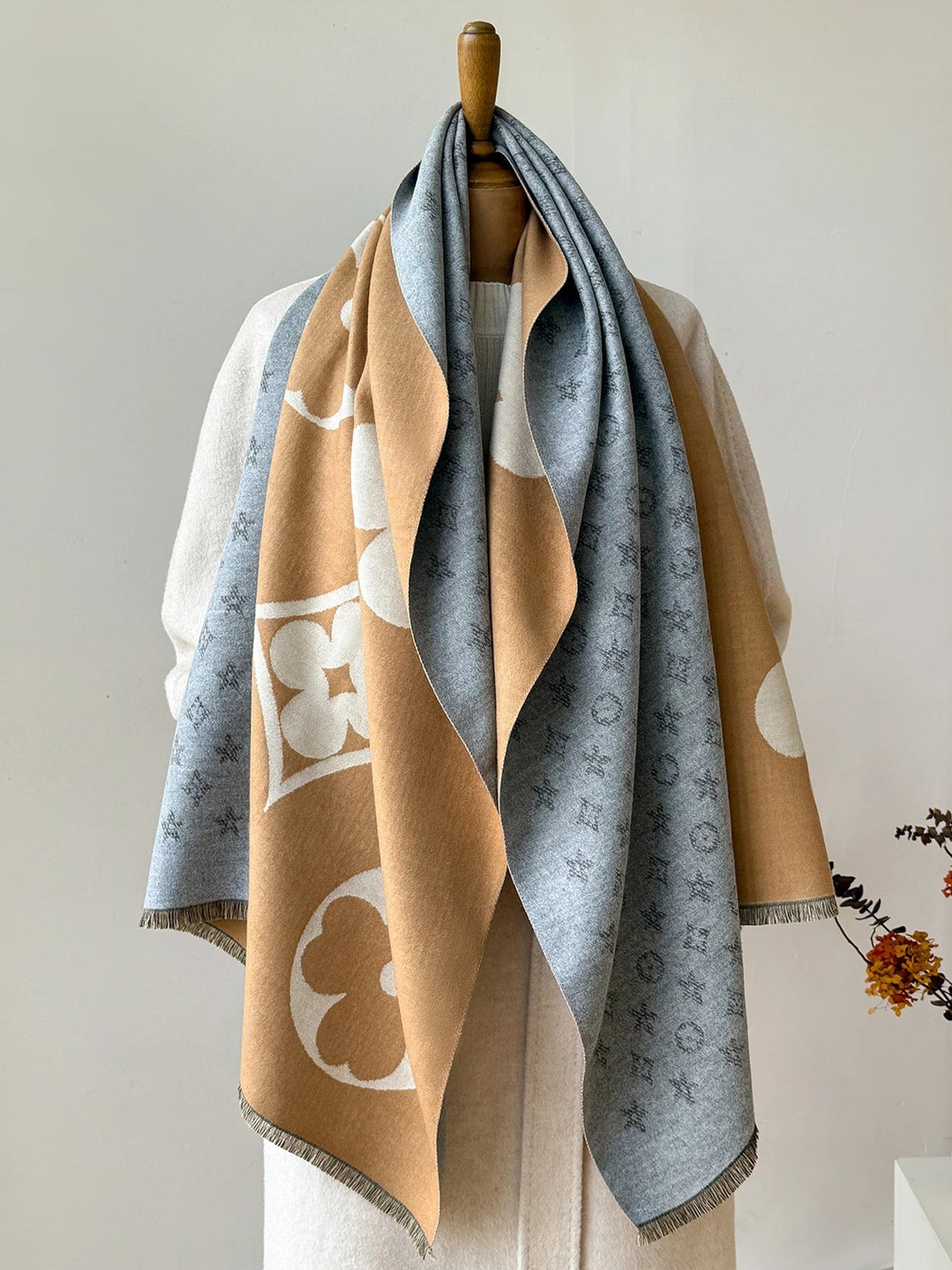 Oversized jacquard scarf in blue-gray and camel with large floral and monogram-style motifs