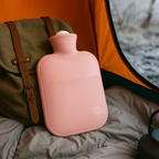 Large hot water bottle with ribbed soft cover, blush pink, round embossed badge