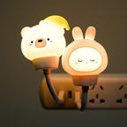 Silicone animal night light pair with bear and bunny cups, warm glow