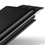 Close-up side view of black wallet with pop-up push rail and card insert slot