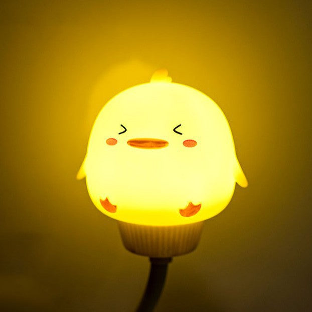 Silicone chick-shaped night light with soft cup and warm glow