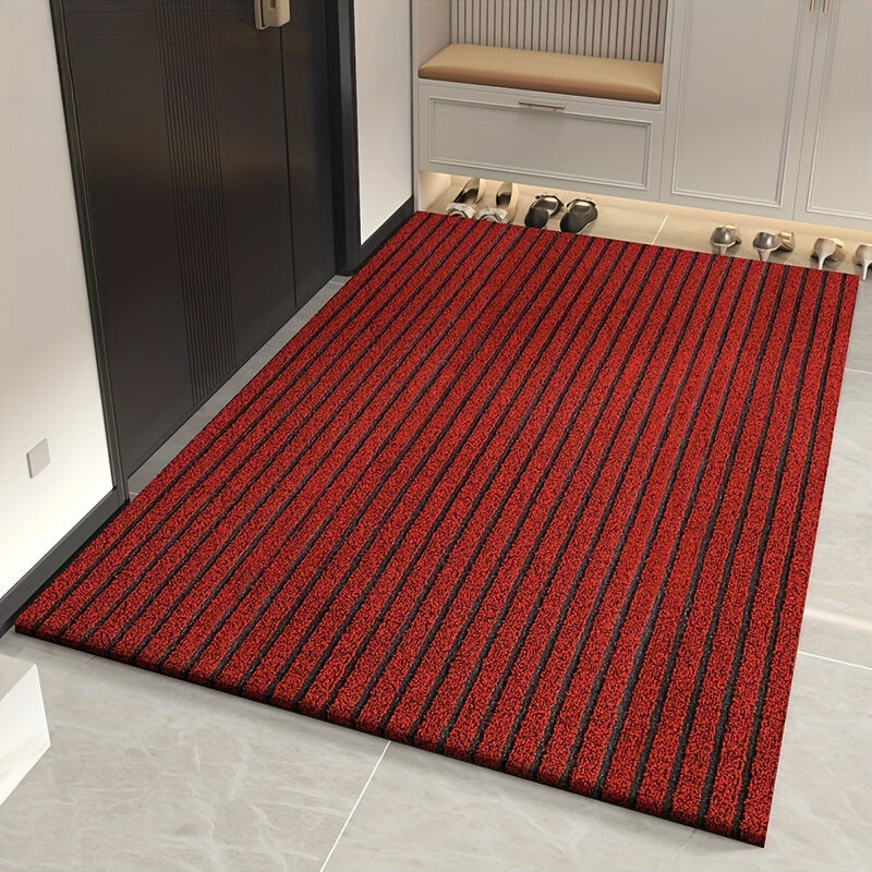 Red low-profile ribbed entry doormat with dense textured surface and border