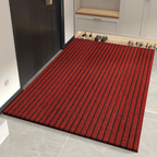 Red low-profile ribbed entry doormat with dense textured surface and border
