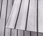 White faux wood slat wall panel close-up, raised texture with dark divider lines