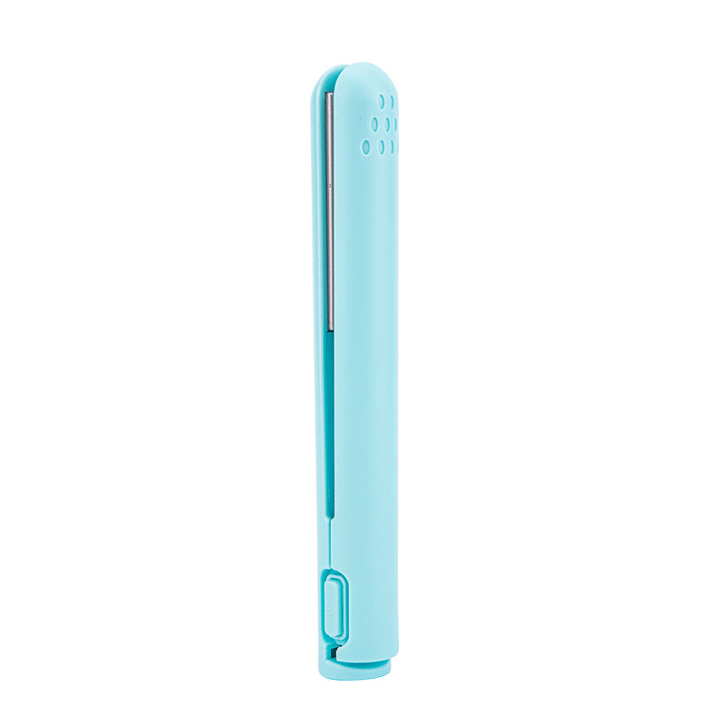 Mini 2-in-1 travel curling and straightening iron in light blue, upright front view.