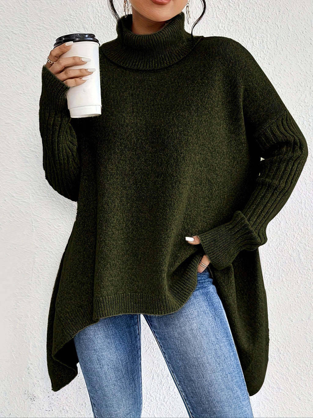 Green women’s loose turtleneck sweater with long sleeves and high-low hem