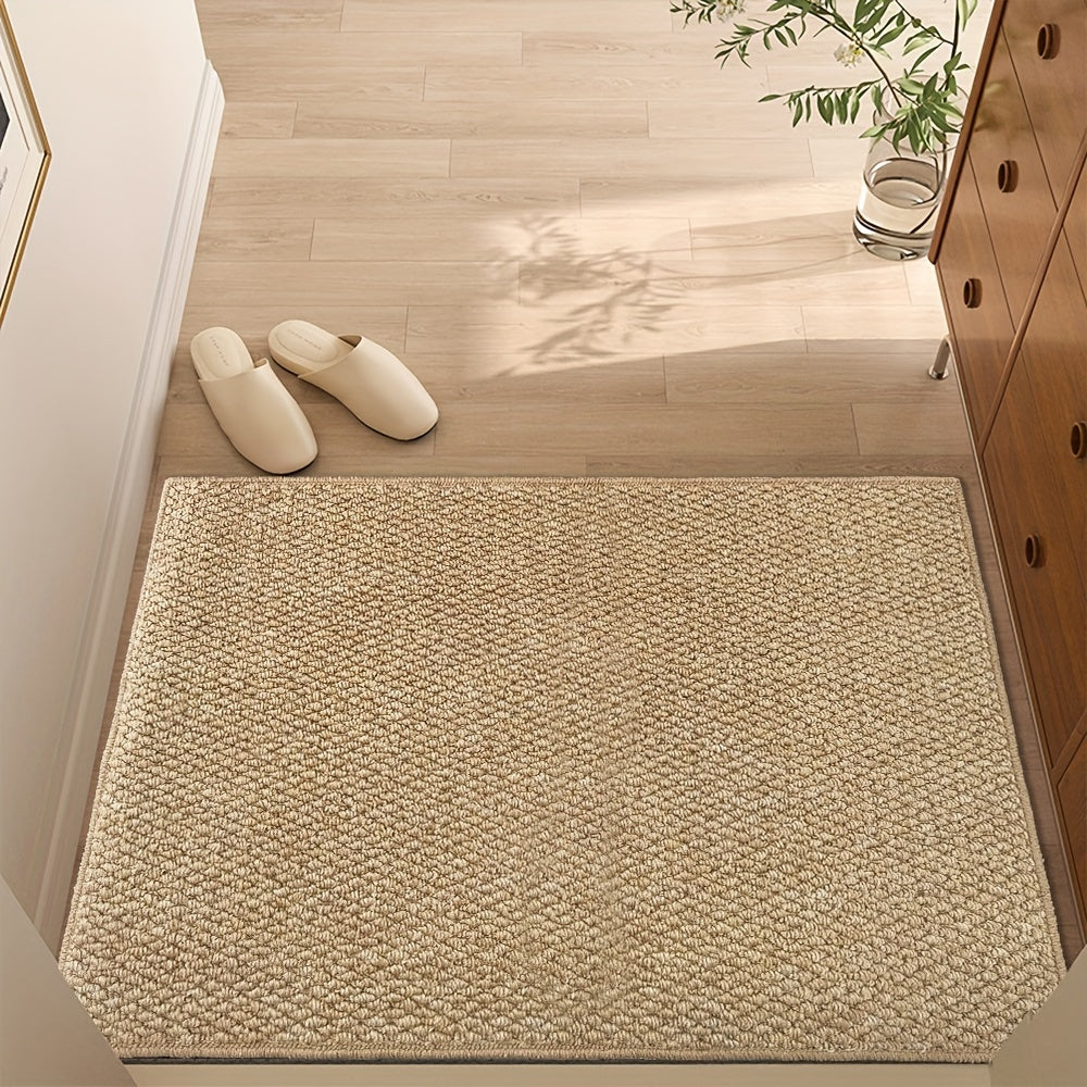 Tan jute-look indoor entry rug with dense woven texture and flat edges.