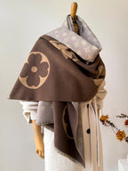 Oversized jacquard scarf in dark brown and light gray with large flower motif and fringe trim