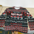 Kissmas rock Christmas sweater in black, red, and white fair isle knit.
