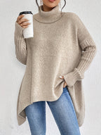 Beige khaki women’s knit turtleneck sweater with long sleeves and high-low hem