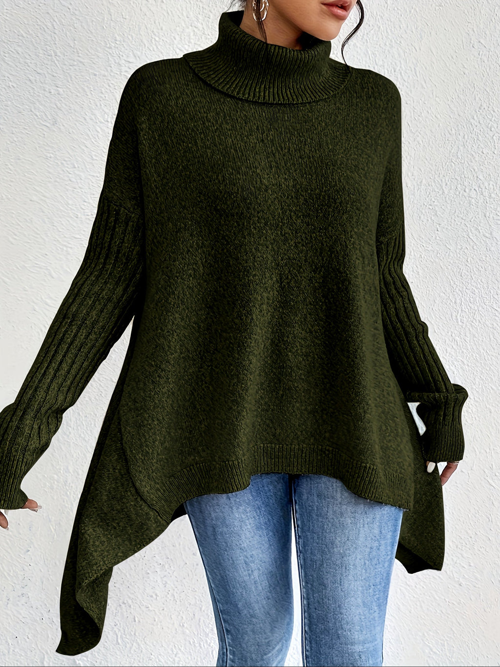 Women's loose turtleneck sweater in deep green, long sleeves, ribbed cuffs, asym hem