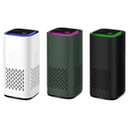 Compact air purifier in white, green, and black with LED-lit top panels