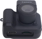 Mini digital camera close-up with textured grip, lens, and charging ports