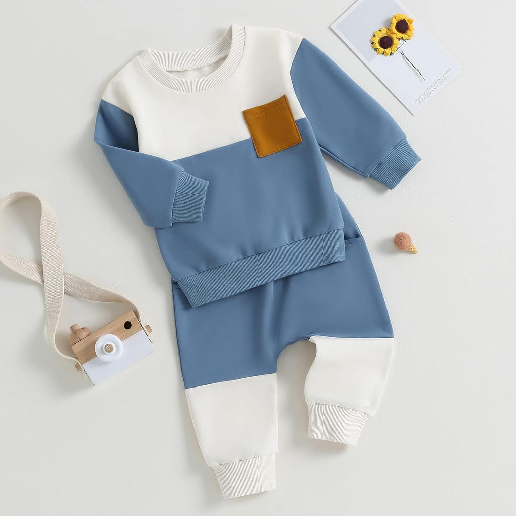 Baby 2-piece outfit: light blue and white sweatshirt with orange pocket and matching pants