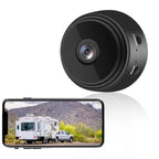 Wireless backup camera lens unit with circular black housing and wide-angle lens