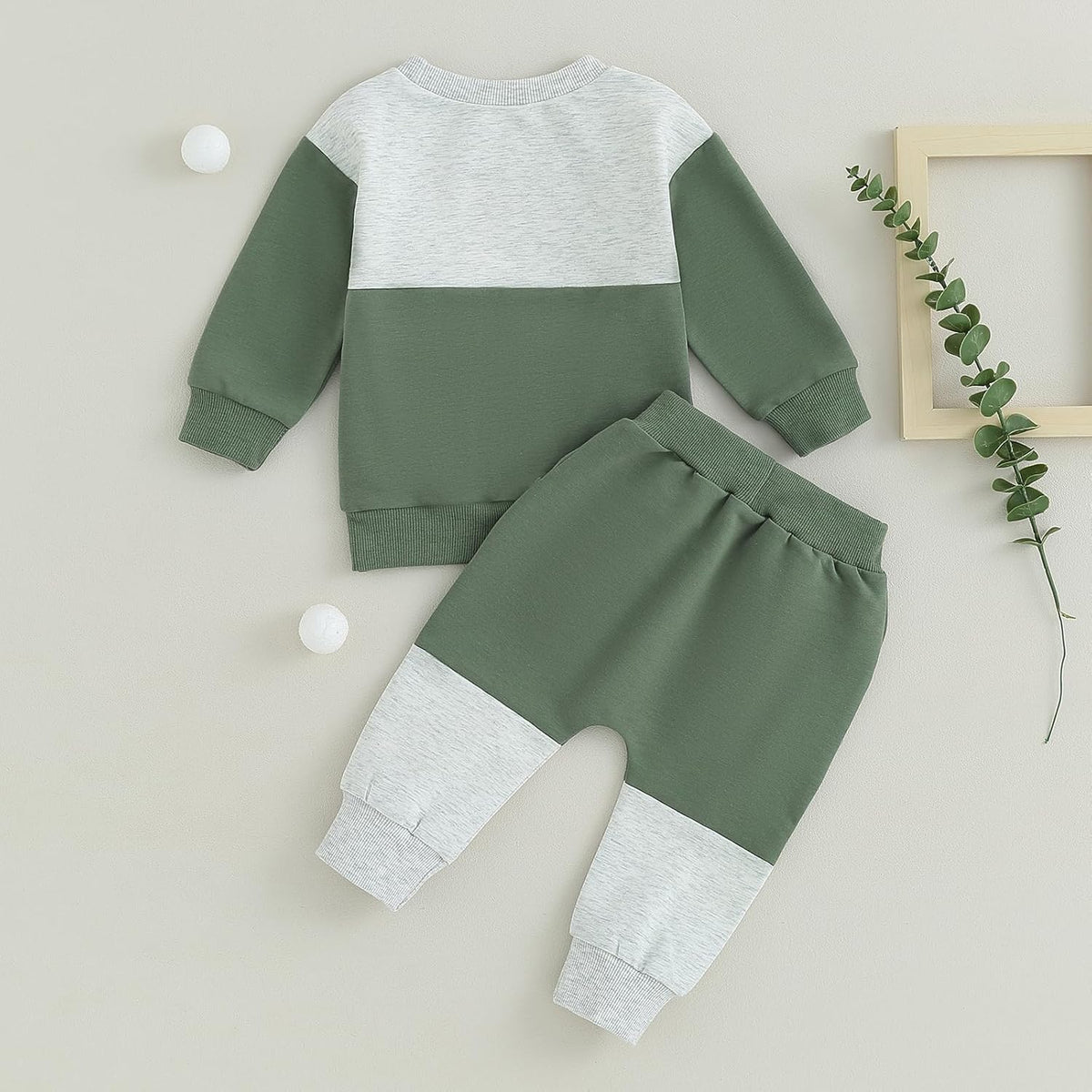 Baby Jogger 2-piece winter outfit: sage green and white colorblock sweatshirt + sweatpants.