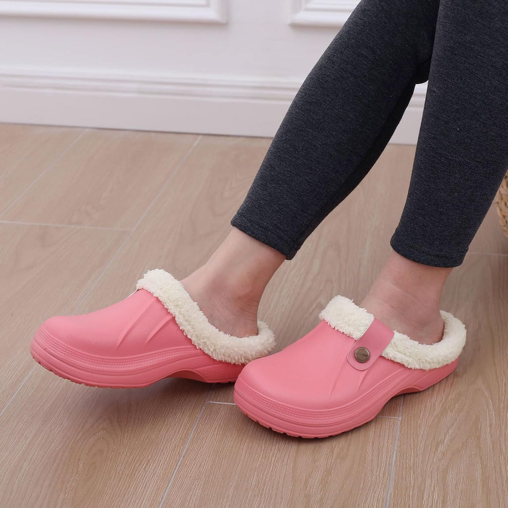 Marmari warm lined slip-on clogs, pink with sherpa lining worn with dark pants