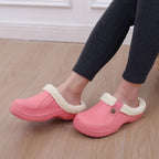 Marmari warm lined slip-on clogs, pink with sherpa lining worn with dark pants