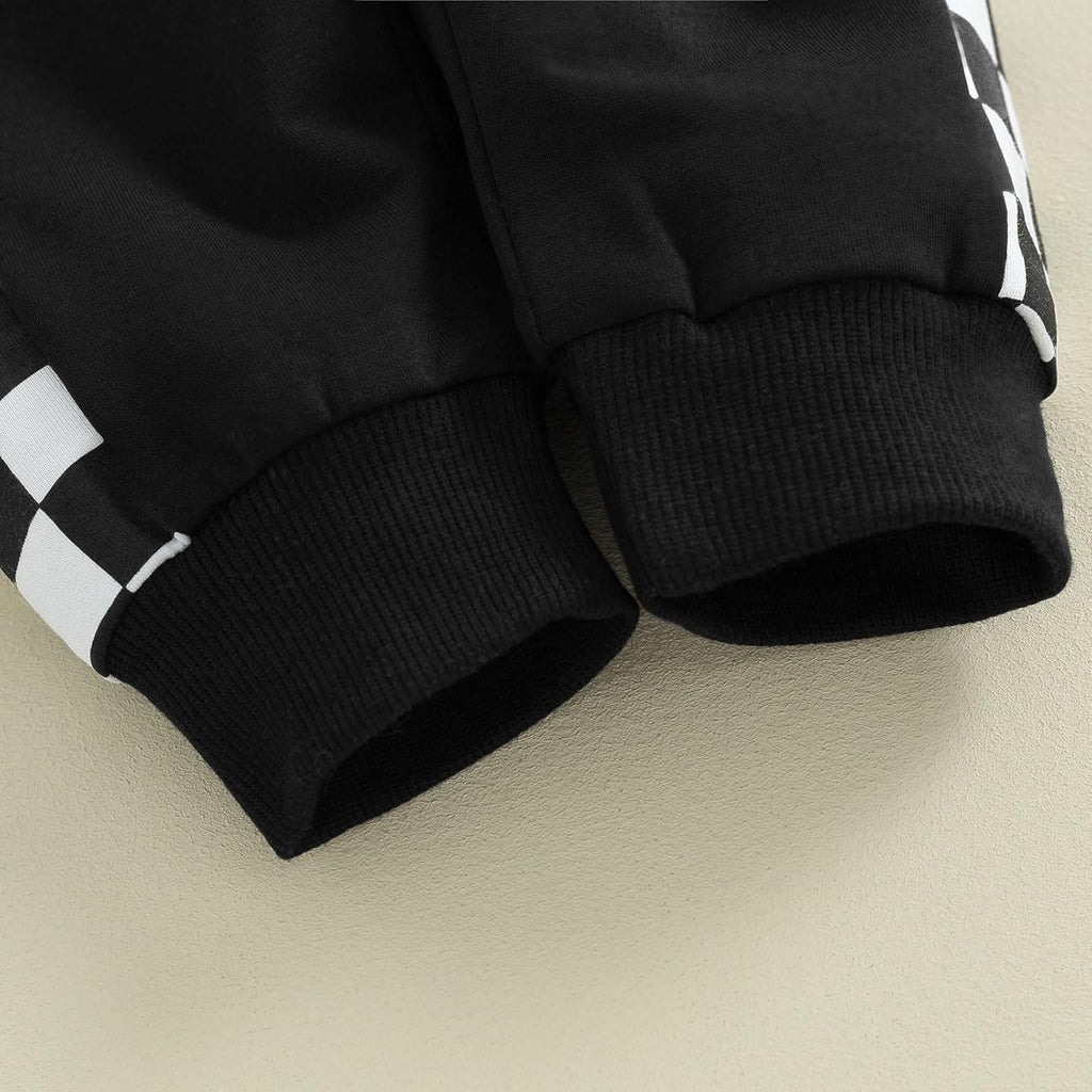 Black stretch pants with ribbed cuffs and folded knit hem detail