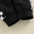 Black stretch pants with ribbed cuffs and folded knit hem detail