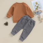 Baby Jogger 2-piece winter outfit: tan sweatshirt with gray sweatpants, cuffed legs.