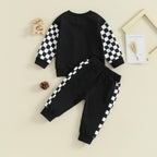 Baby Jogger 2-piece winter outfit: black sweatshirt and sweatpants with white checkered sleeve bands.