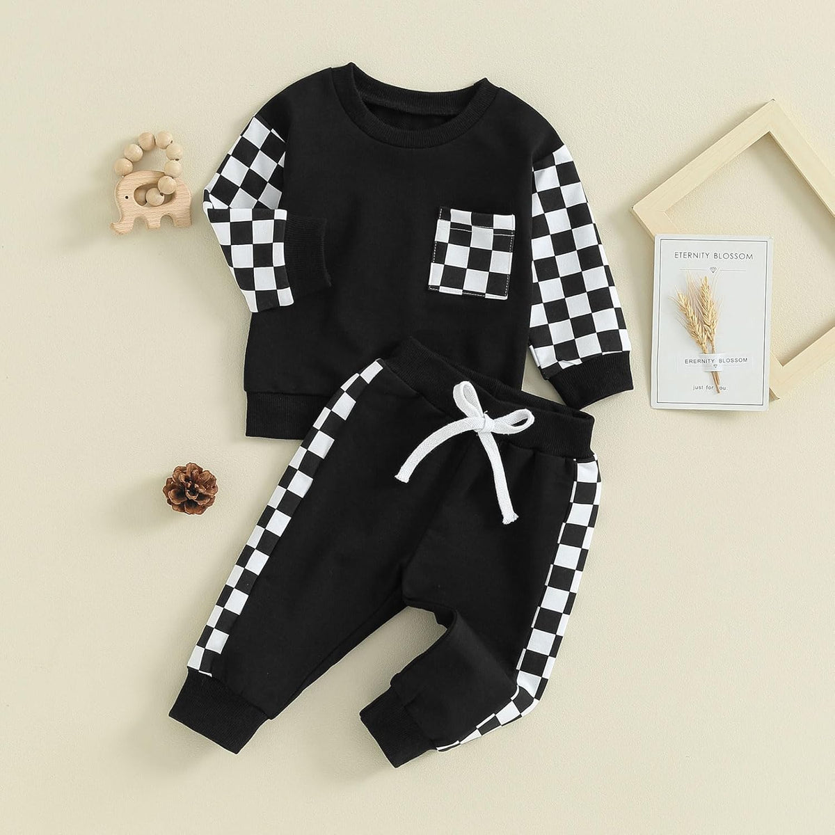 Black baby jogger outfit set with checkered sleeves and white drawstring