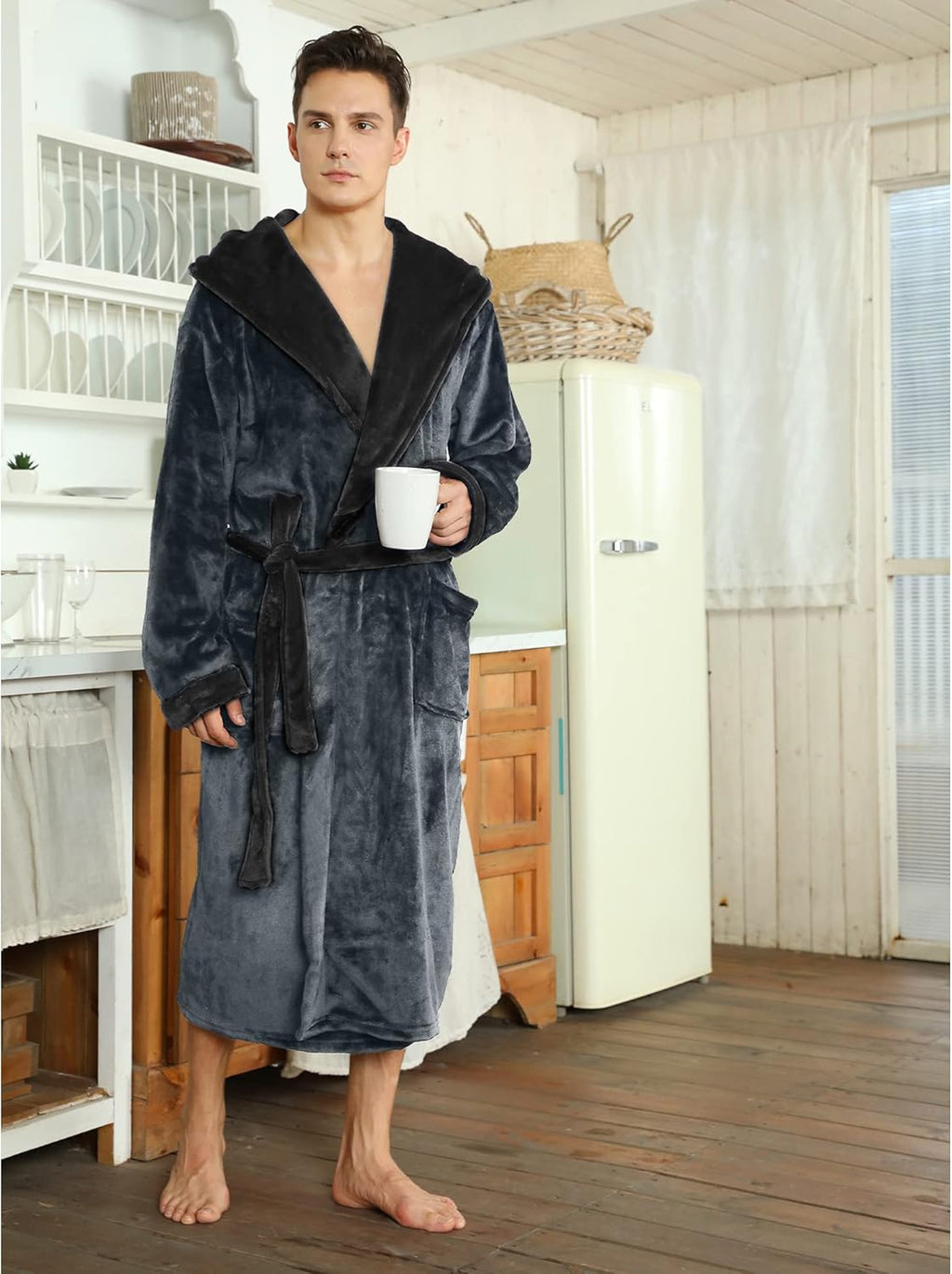 Two-tone hooded fleece robe holding mug, dark gray with black hood lining and belt
