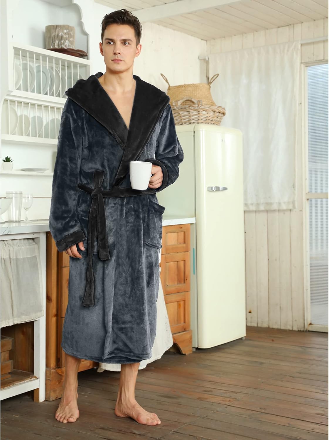 Two-tone hooded fleece robe holding mug, dark gray with black hood lining and belt