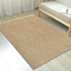Tan jute-look entry mat with uniform woven pattern and tidy border.