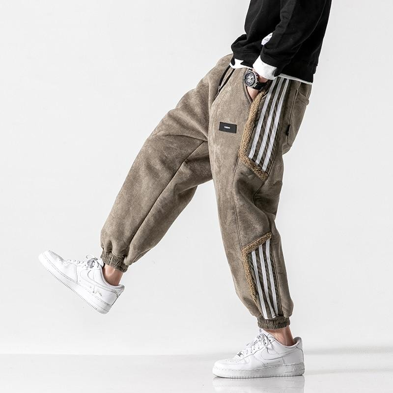 Sherpa-lined brown jogger sweatpants with white side stripes and elastic cuffs